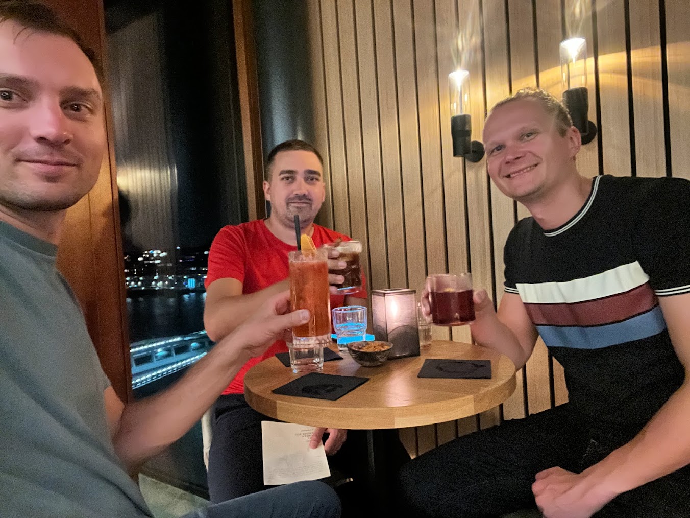 Master Packager team cheerfully enjoying drinks.
