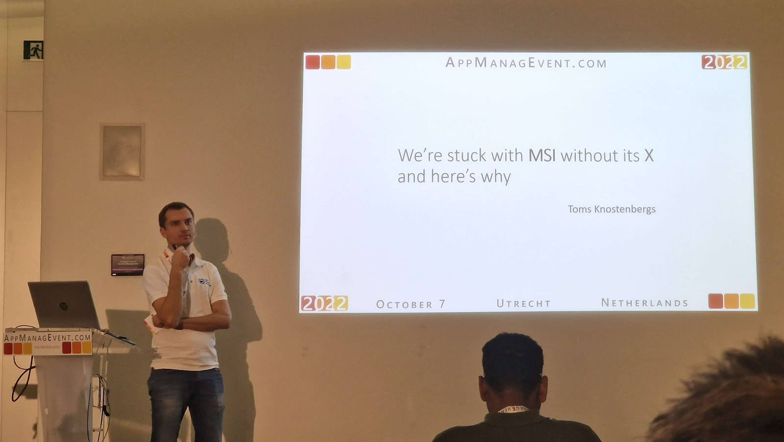 Presentation slide titled We are stuck with MSI without its X and here is why with Toms presenting the session during the event.